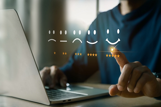 User at laptop leaving a positive review