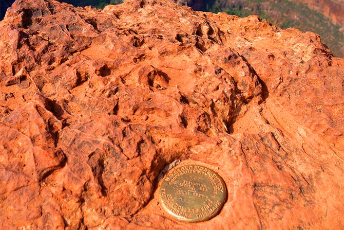Rock formation with a metal surveying mark