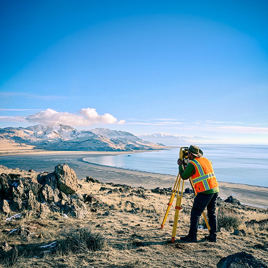 Why-the-Utah-Council-feature - Man surveying on a hill near a lake